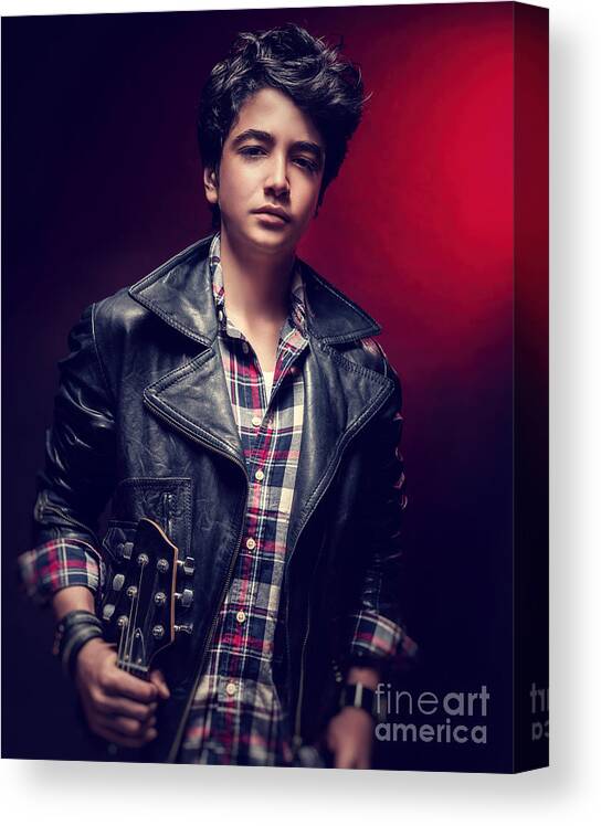 Adolescence Canvas Print featuring the photograph Teen guy posing with guitar by Anna Om