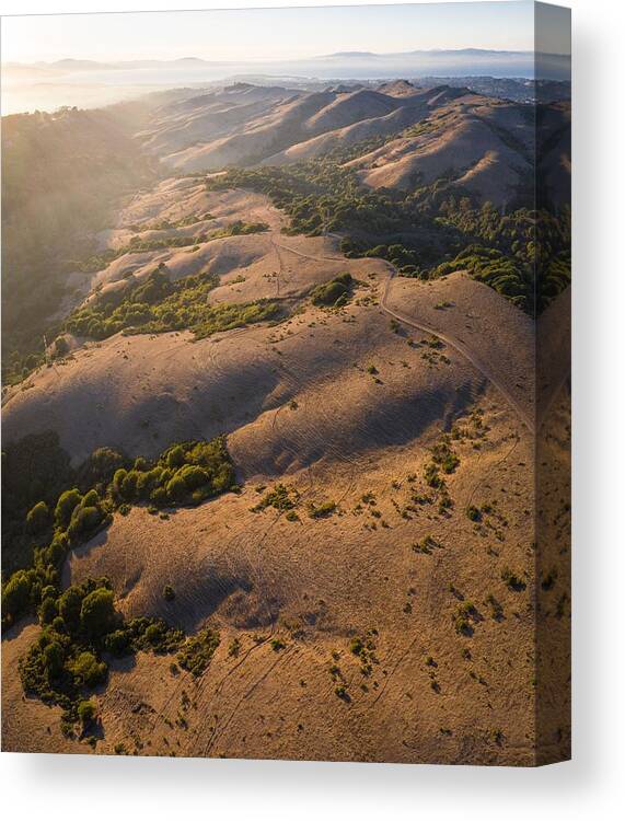 Landscapeaerial Canvas Print featuring the photograph The Last Light Of Day Illuminates San #1 by Ethan Daniels