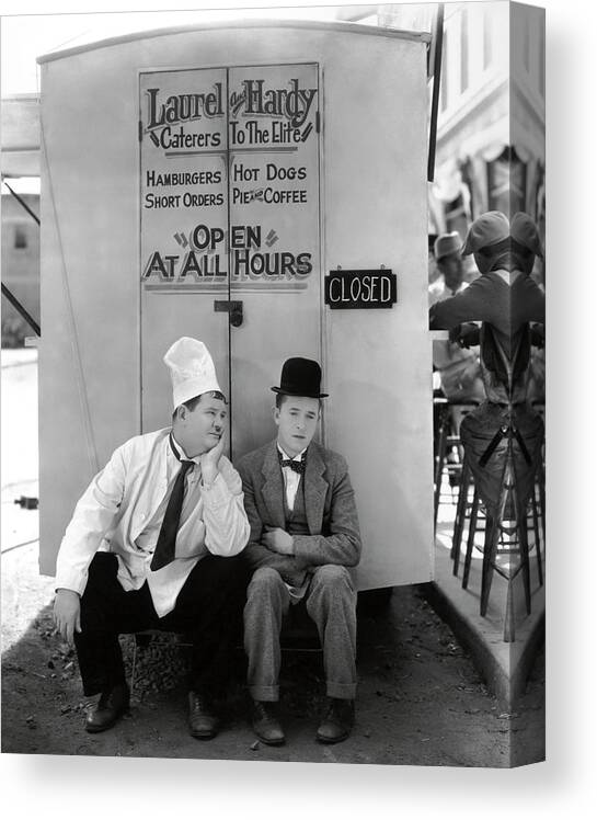 Oliver Hardy Canvas Print featuring the photograph OLIVER HARDY and STAN LAUREL in PACK UP YOUR TROUBLES -1932-. #2 by Album