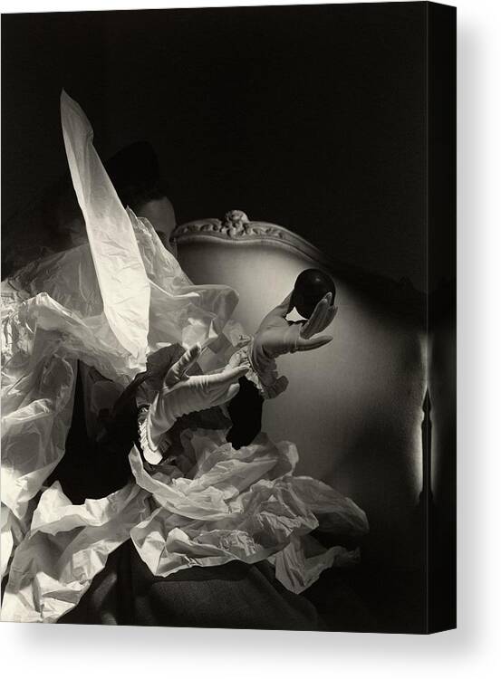 #new2022vogue Canvas Print featuring the photograph A Pair Of Hands In Gloves Holding An Apple by Horst P Horst
