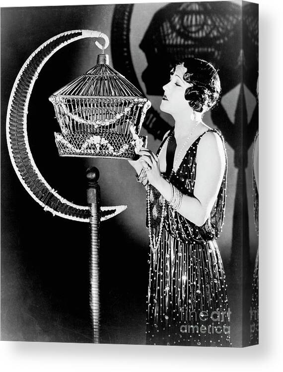 Gloria Swanson Canvas Print featuring the photograph Actress Gloria Swanson Examining A Bird by Bettmann