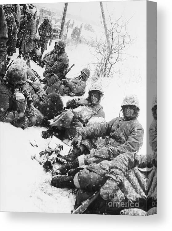 Korea Canvas Print featuring the photograph American Marines Rest In Snow In Korea by Bettmann