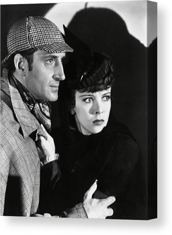 Basil Rathbone Canvas Print featuring the photograph BASIL RATHBONE and IDA LUPINO in THE ADVENTURES OF SHERLOCK HOLMES -1939-. by Album