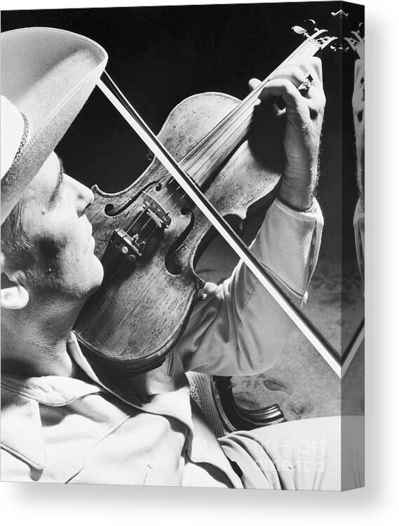 Country And Western Music Canvas Print featuring the photograph Bob Wills Playing Fiddle by Bettmann