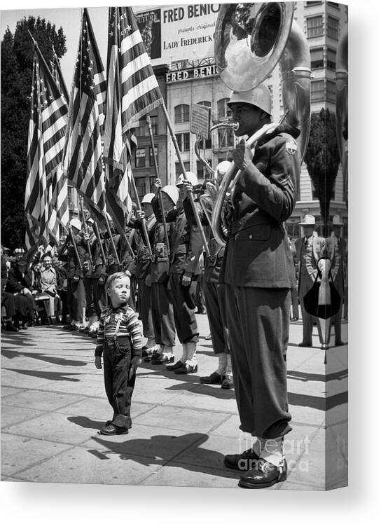 Toddler Canvas Print featuring the photograph Boy Listening To Tuba Player by Bettmann