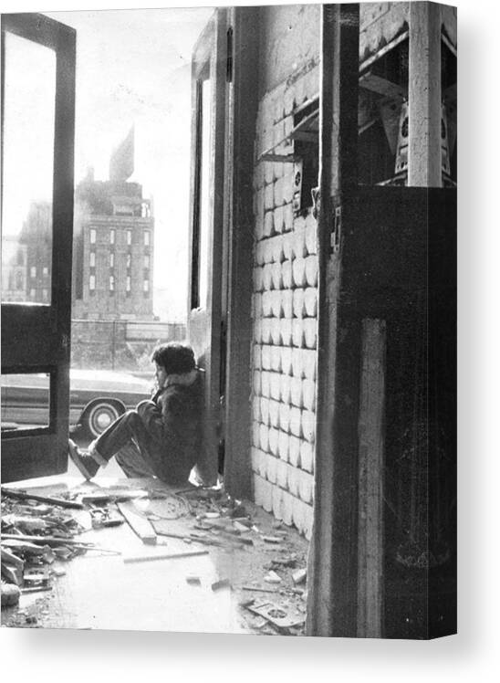 Child Canvas Print featuring the photograph Child Sits In Doorway Of Rundown by New York Daily News Archive