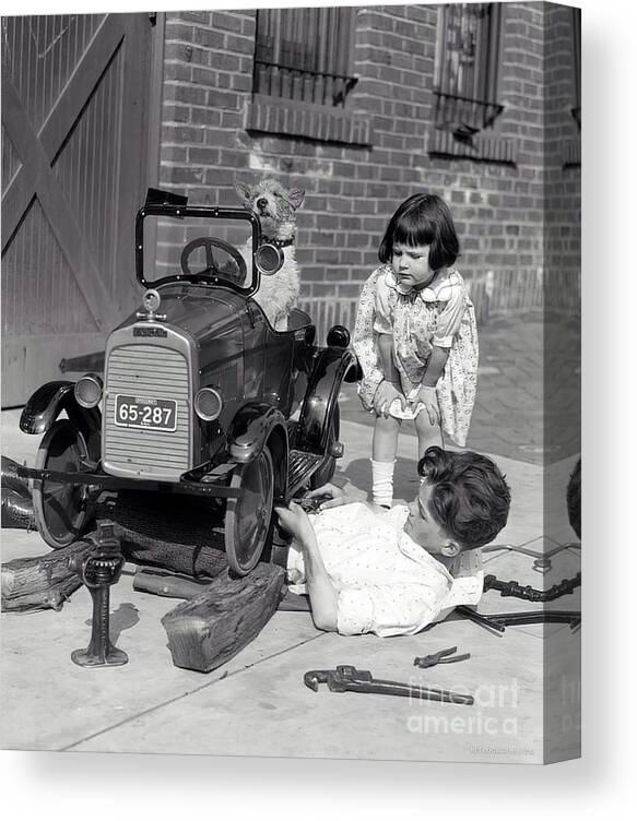 Vintage Canvas Print featuring the photograph Children And Dog Repairing 1920s Pedal Car by Retrographs