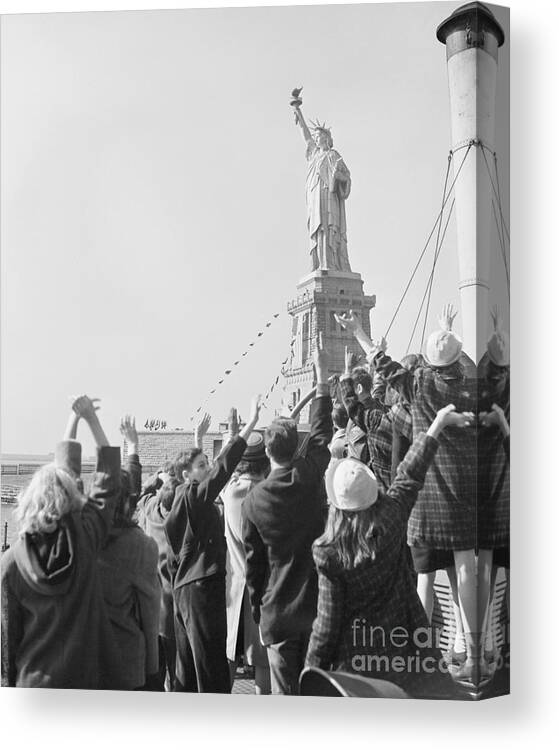 Crowd Of People Canvas Print featuring the photograph Children Waving To Statue Of Liberty by Bettmann