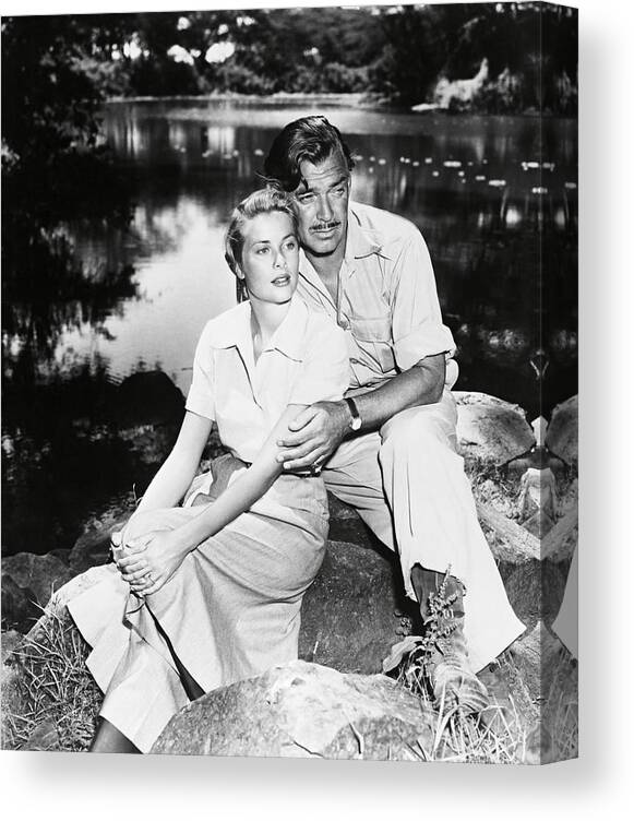 Clark Gable Canvas Print featuring the photograph CLARK GABLE and GRACE KELLY in MOGAMBO -1953-. by Album