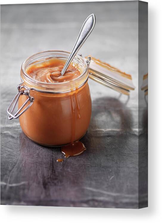Spoon Canvas Print featuring the photograph Close Up Of Pot Of Caramel Sauce by Danielle Wood