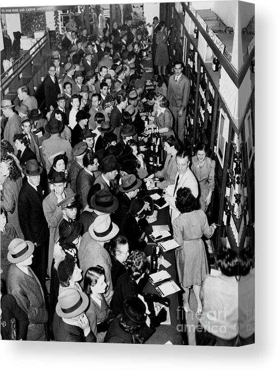Crowd Canvas Print featuring the photograph Crowds Storm The Counter At Macys by New York Daily News Archive