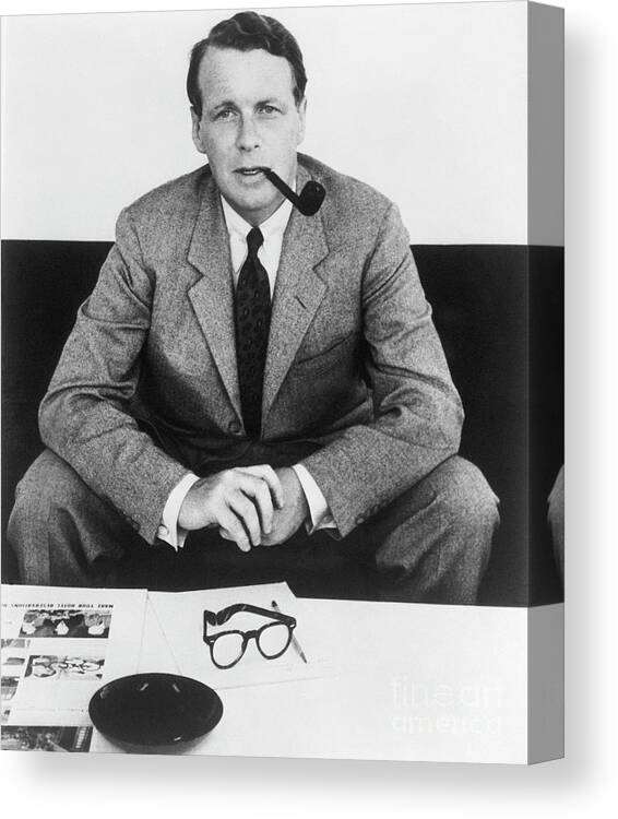 Corporate Business Canvas Print featuring the photograph David Ogilvy With Smoking Pipe by Bettmann