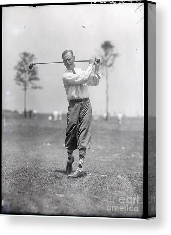 People Canvas Print featuring the photograph Golfer In Post-swing Position by Bettmann