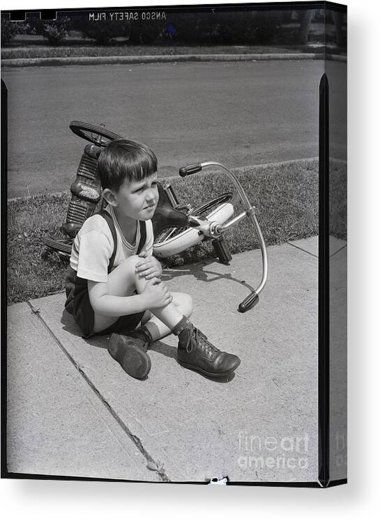 Child Canvas Print featuring the photograph Little Boy With Overturned Tricycle by Bettmann