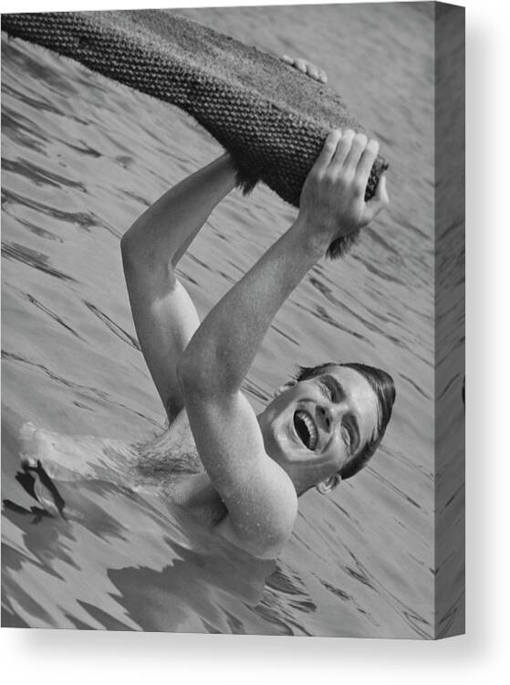 Hanging Canvas Print featuring the photograph Man Hanging From Diving Board B&w by George Marks