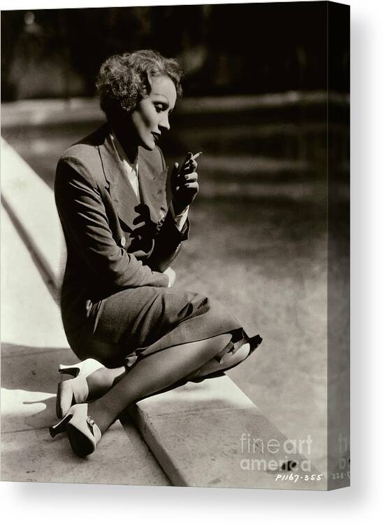 People Canvas Print featuring the photograph Marlene Dietrich Sitting At Pool by Bettmann