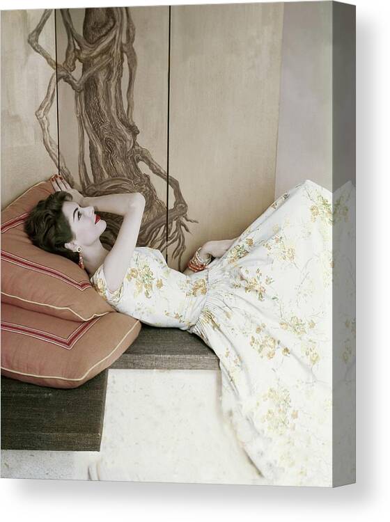 #new2022vogue Canvas Print featuring the photograph Model Reclining Beneath A Screen Painted by Frances McLaughlin-Gill