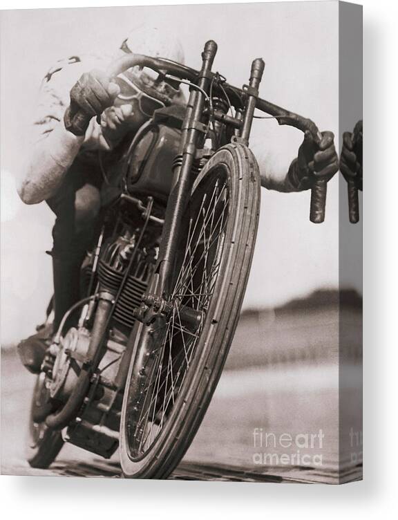 Recreational Pursuit Canvas Print featuring the photograph Ralph Hepburn Riding Motorcycle by Bettmann