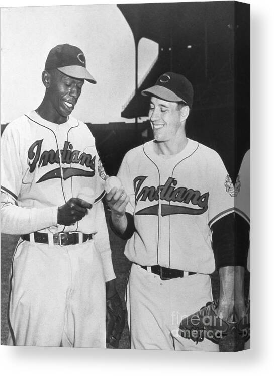 American League Baseball Canvas Print featuring the photograph Satchel Paige Bob Feller Comparing by Transcendental Graphics