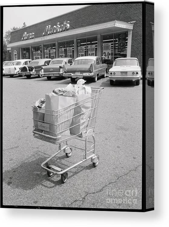 1950-1959 Canvas Print featuring the photograph Shopping Cart In Parking Lot by Bettmann
