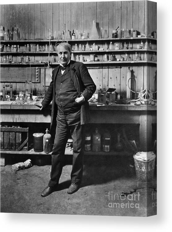 Mature Adult Canvas Print featuring the photograph Thomas Edison Standing In Chemistry Lab by Bettmann
