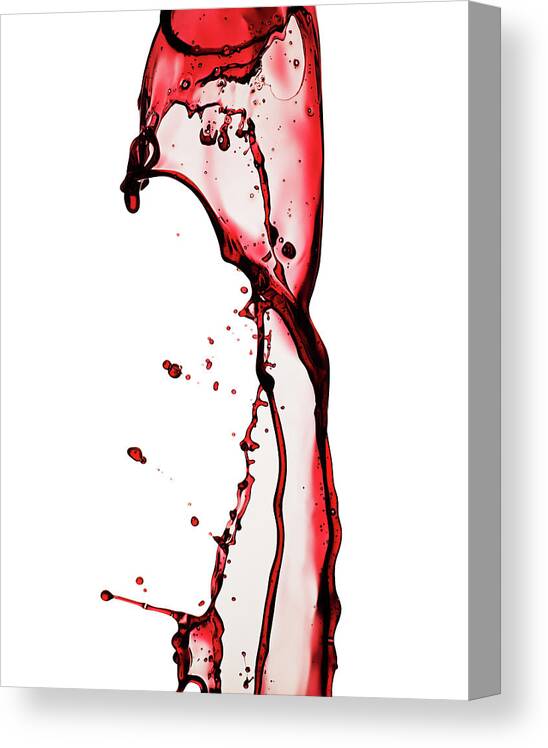 White Background Canvas Print featuring the photograph Wine Splash Isolated On White by Kedsanee