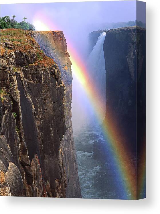 Water Canvas Print featuring the photograph RAINBOW AND FALLS, Victoria Falls, Zimbabwe, Africa by Don Schimmel