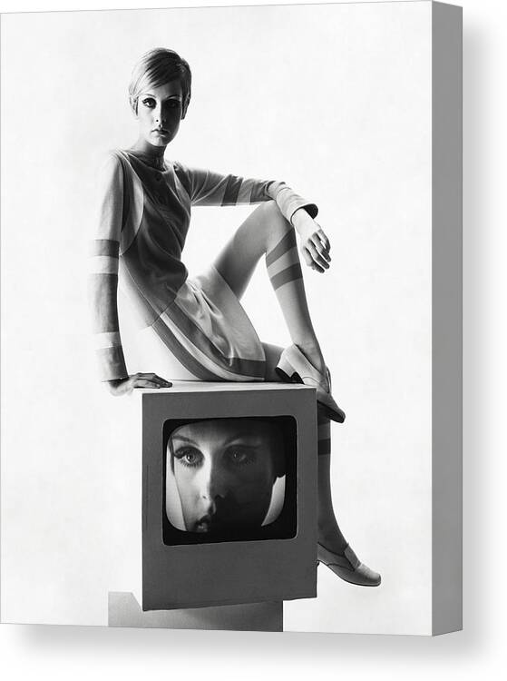 Model Canvas Print featuring the photograph Twiggy Atop A Television Box by Bert Stern