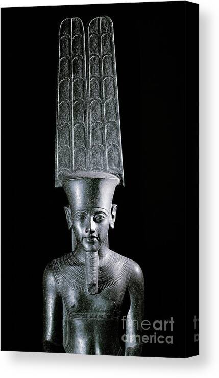 Egyptian Canvas Print featuring the sculpture The god Amon, protecting the pharaoh Tutankhamun by Egyptian School