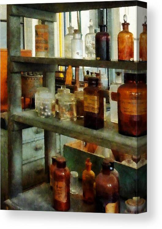 Science Canvas Print featuring the photograph Chemist - Bottles of Chemicals Tall and Short by Susan Savad
