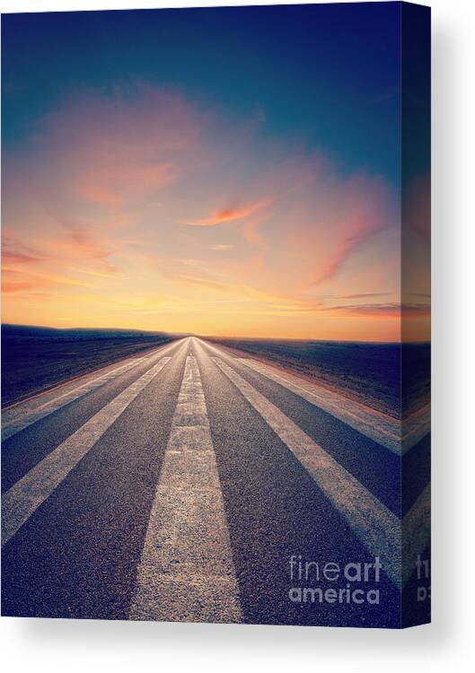 Road Canvas Print featuring the photograph Lonely Road at Sunset by Colin and Linda McKie