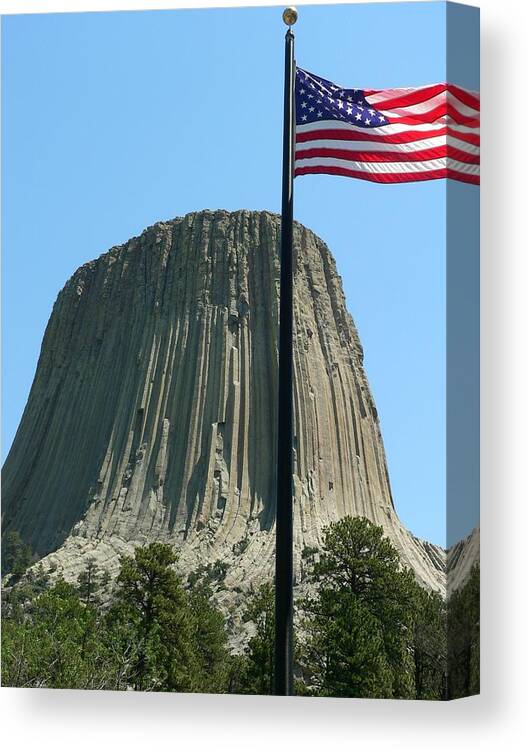 Devil's Tower Canvas Print featuring the photograph Devil's Tower Old Glory by Jeff Lowe
