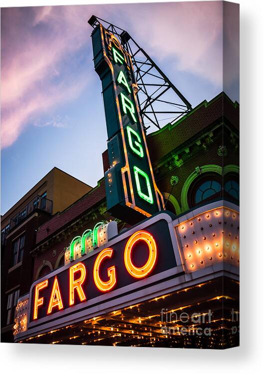 Fargo Canvas Print featuring the photograph Fargo Theater and Marquee Sign at Night Photo by Paul Velgos