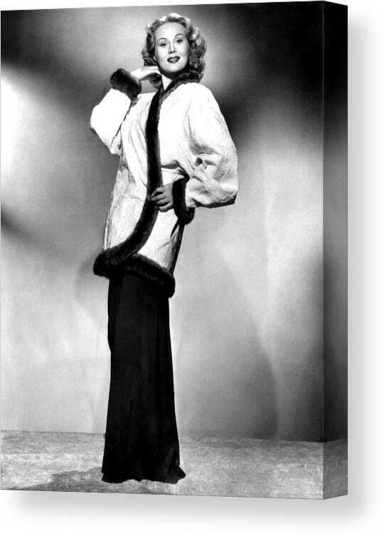 1940s Portraits Canvas Print featuring the photograph Virginia Mayo Modeling Cocktail Jacket by Everett