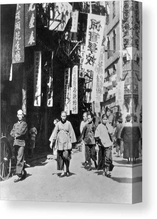 1920s Canvas Print featuring the photograph A Street In Hong Kong by Underwood Archives