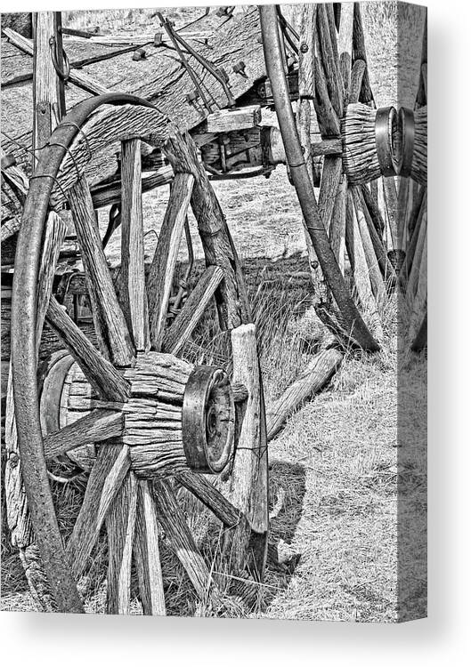 Wheel Canvas Print featuring the photograph Montana Old Wagon Wheels Monochrome by Jennie Marie Schell