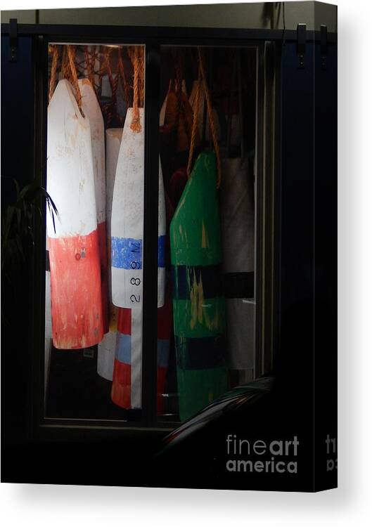 Buoys Displayed Side By Side Inside A Display Window In Downtown Key West .evening Canvas Print featuring the photograph Window Buoys key West by Priscilla Batzell Expressionist Art Studio Gallery