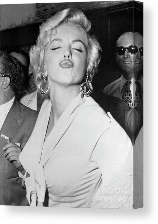 Mid Adult Women Canvas Print featuring the photograph Marilyn Monroe Puckering Lips #1 by Bettmann