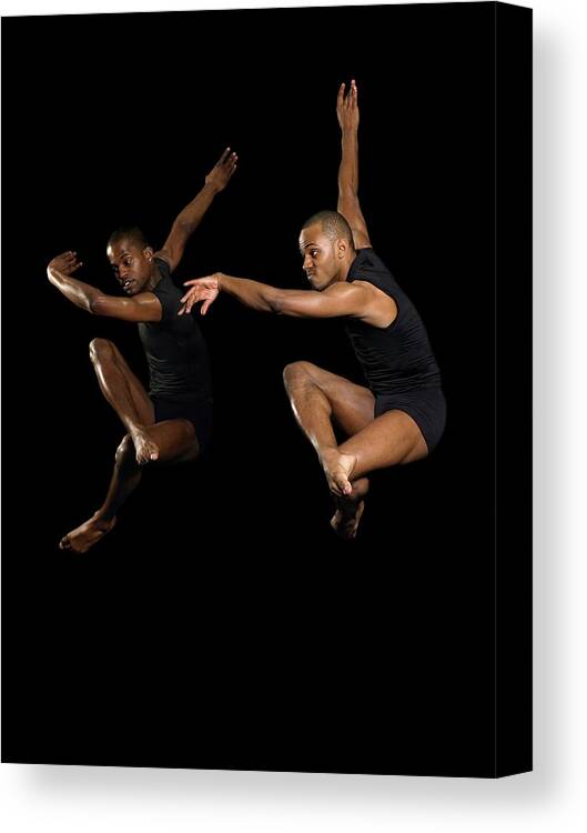 Young Men Canvas Print featuring the photograph Two Male Dancers Jumping #1 by Image Source