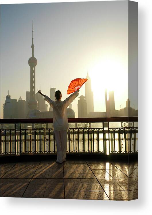 Chinese Culture Canvas Print featuring the photograph Chinese Woman Fan Dancing In Front Of by Xpacifica