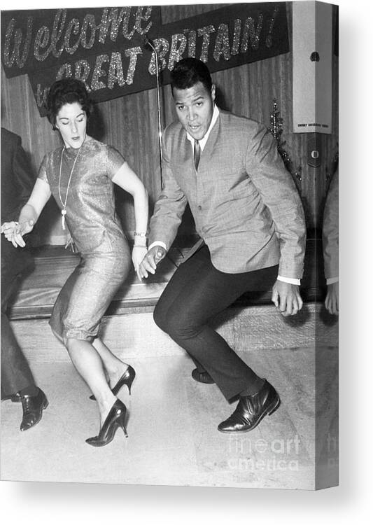Rock Music Canvas Print featuring the photograph Chubby Checker Twists With Woman by Bettmann