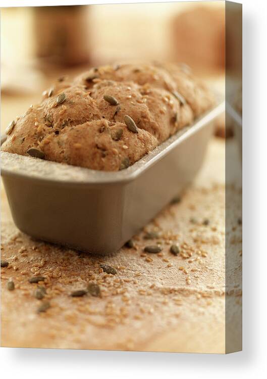 Close-up Canvas Print featuring the photograph Close Up Of Rustic Bread In Loaf Pan by Adam Gault