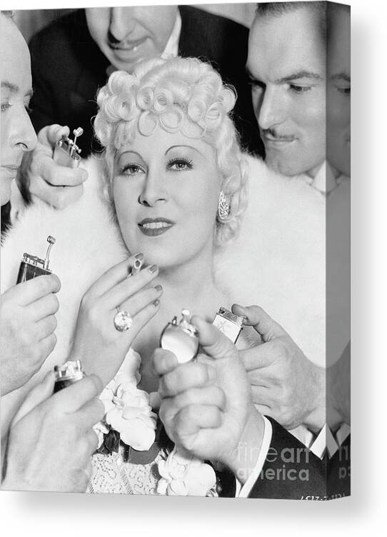 Mid Adult Women Canvas Print featuring the photograph Men Offering To Light Cigarette For Mae by Bettmann