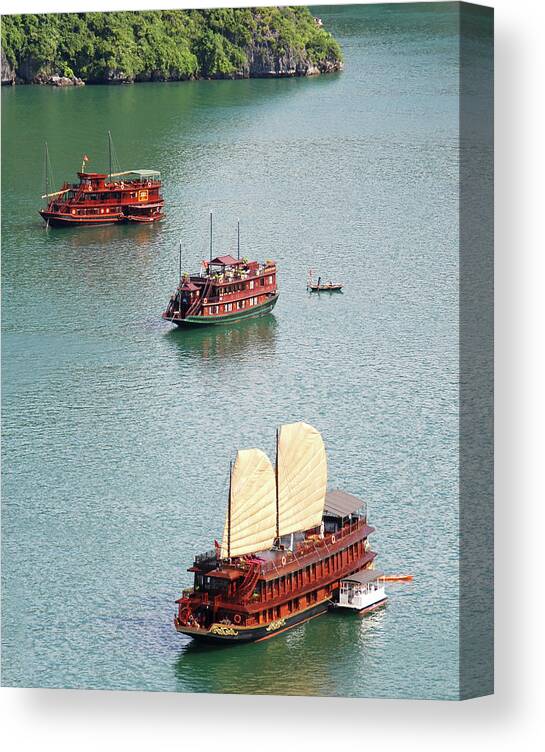 Seascape Canvas Print featuring the photograph Tourist wooden Boats at Halong Bay Vietnam by Michalakis Ppalis