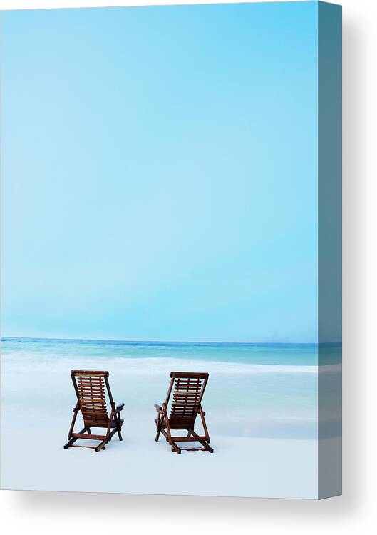 Summer Canvas Print featuring the photograph Two Beach Chairs On Tropical Beach At by Thomas Barwick