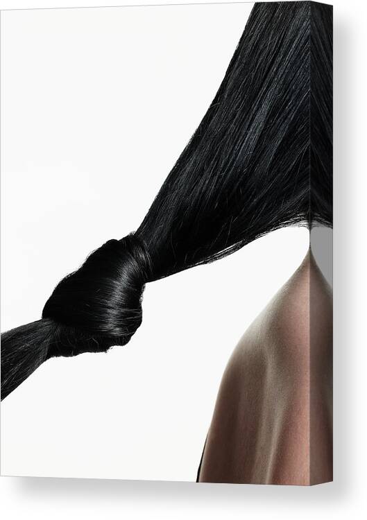 People Canvas Print featuring the photograph Woman With Hair Tied In Knot, Close-up by Christopher Robbins
