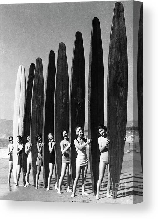 Child Canvas Print featuring the photograph Women With Surf Paddleboards by Bettmann