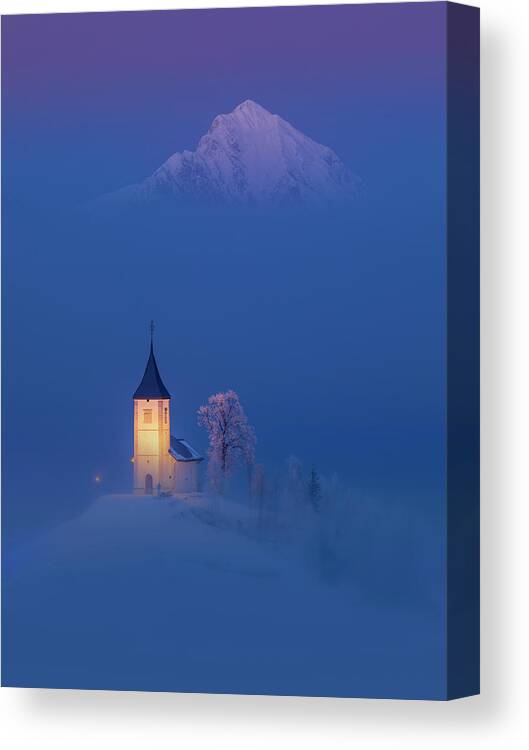 #faatoppicks Landscape Europe Slovenia Alps Winter Church Mountains Snow Dusk Mists Fog Venus Belt Tree Canvas Print featuring the photograph Misty church #1 by Piotr Skrzypiec