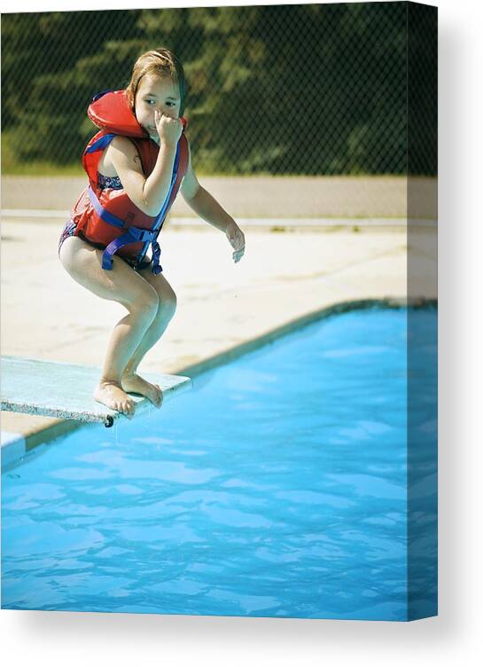 Outdoors Canvas Print featuring the photograph A child jumps off diving board by Design Pics/Kelly Redinger