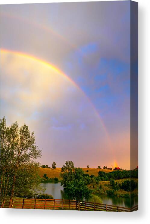 Rainbow Canvas Print featuring the photograph Rainbow over the farm by Alexey Stiop